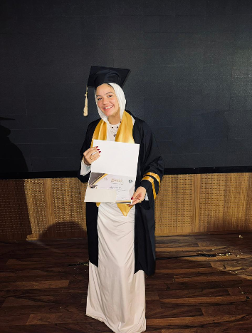 Mariam at her university graduation