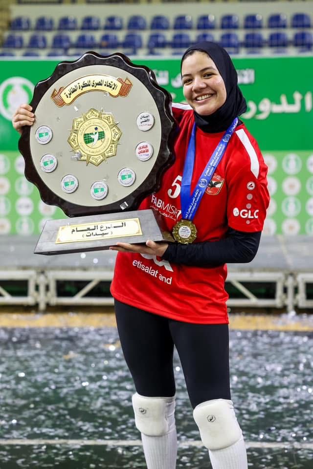 Mariam playing volleyball in a league match